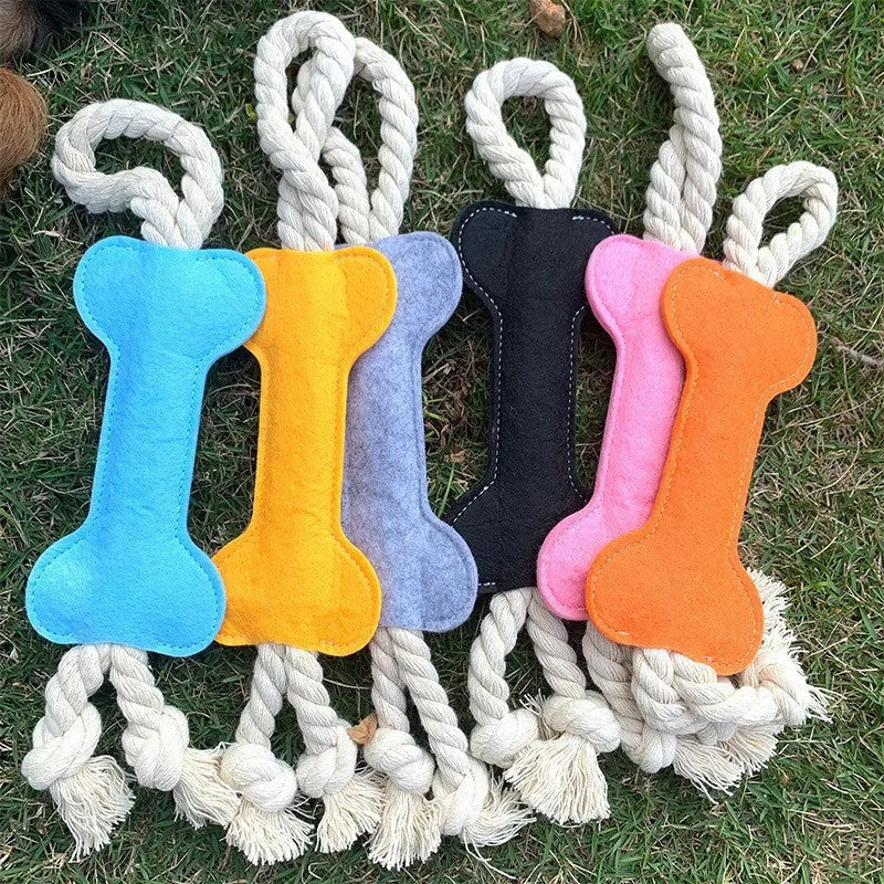 Bone-shaped felt dog chew toy with rope knot interior in blue, shown next to a tape measure indicating 16 cm length.