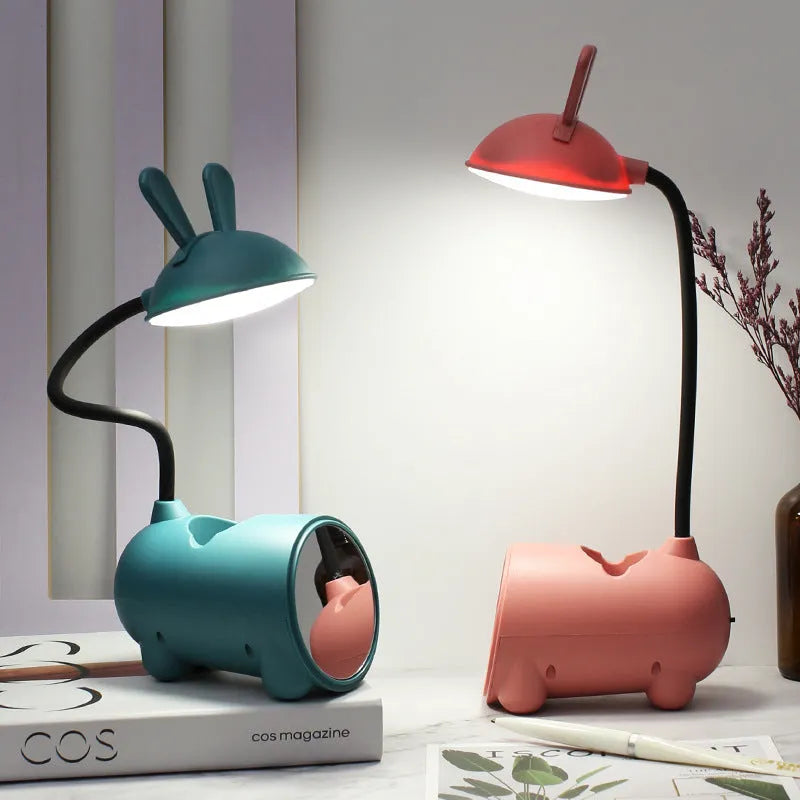 Cartoon-style USB desk lamp with pen container in dark blue, green or pink colours