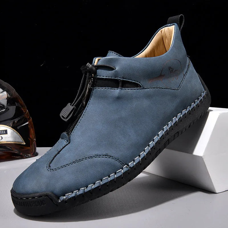 Men's black casual leather sneakers with a mid heel and round toe on a rubber sole.