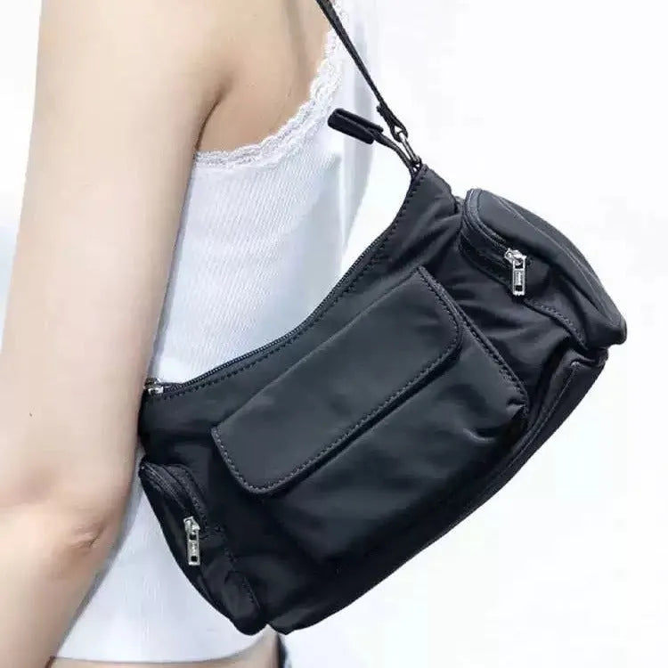 Black nylon unisex shoulder bag with double pockets and side line detail
