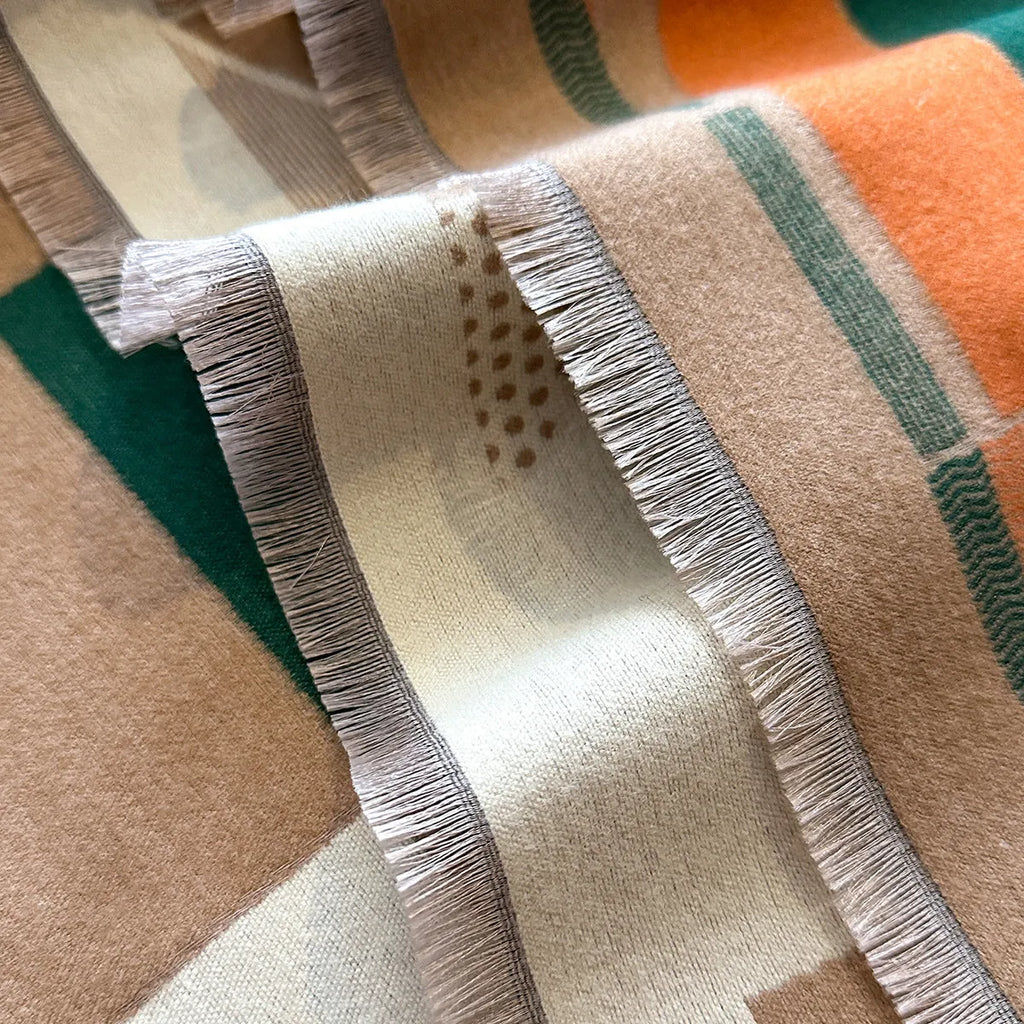 Imitation cashmere polyester scarf in beige colour, showing its 185x65cm size and texture.