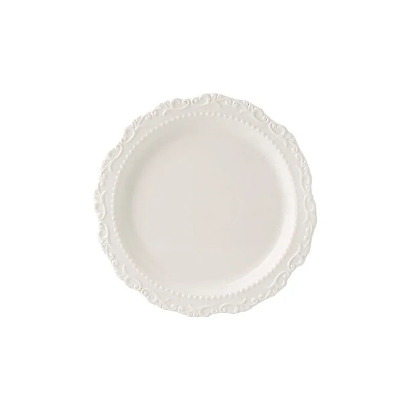 Vintage lace ceramic plate with irregular shape and coloured glaze in white or yellow