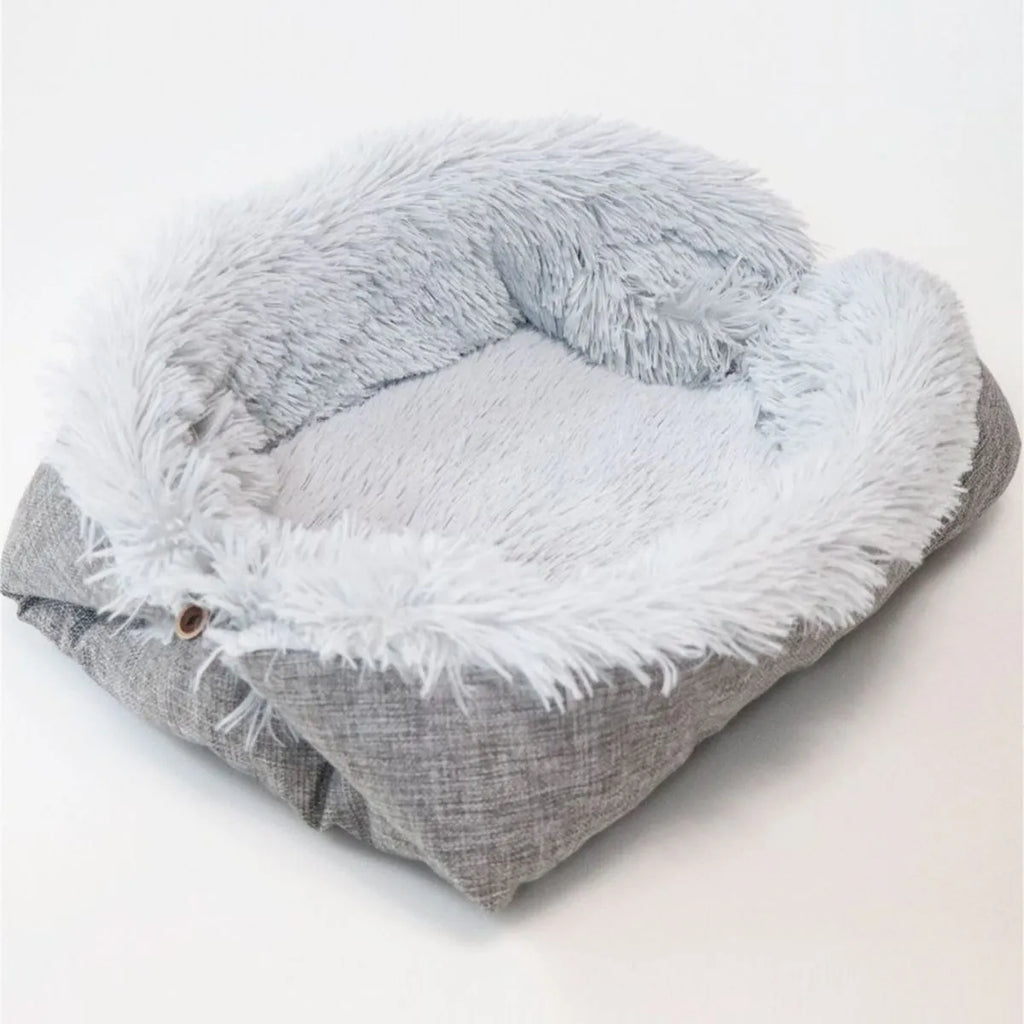 Grey pet plush sleeping pad measuring 61cm by 51cm with a black non-slip bottom.