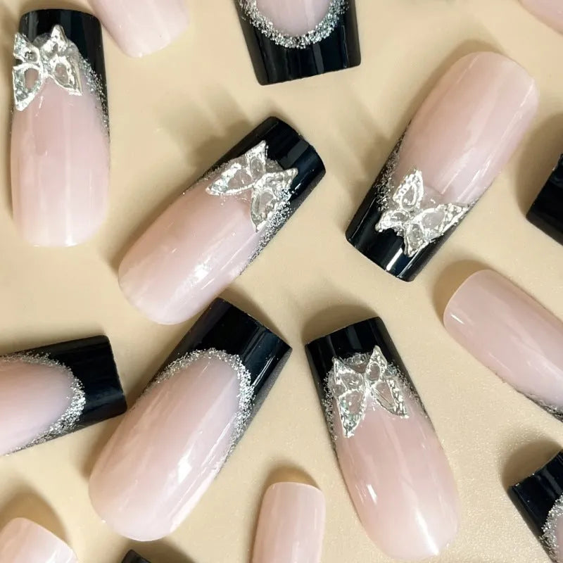 Black French style false nails with glittering butterfly pattern in medium length