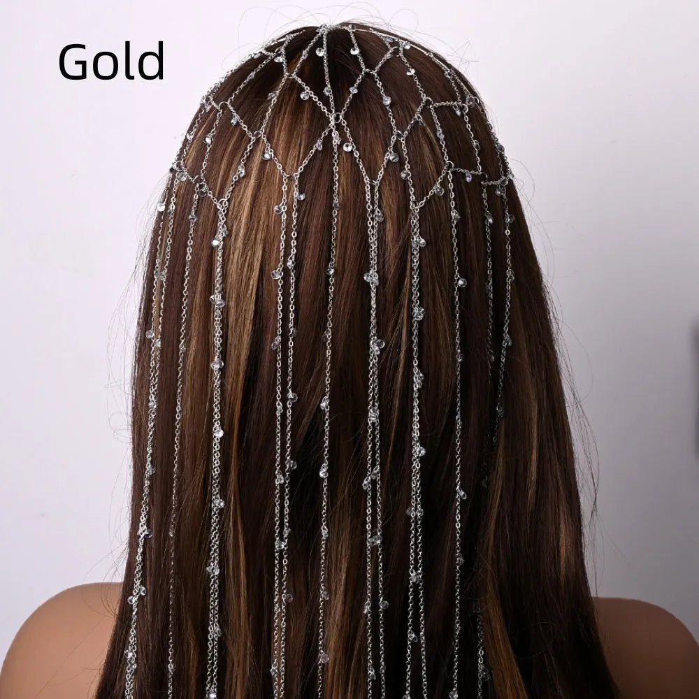 Gold and silver rhinestone headband with a sparkling electroplated finish and a long mesh tassel detail.
