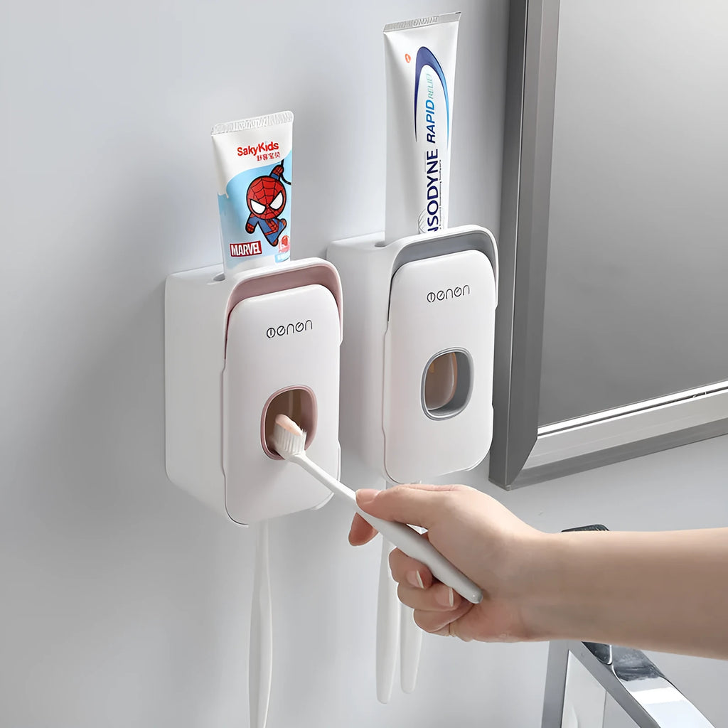 Automatic toothpaste dispenser unit mounted on a bathroom wall in blue colour.