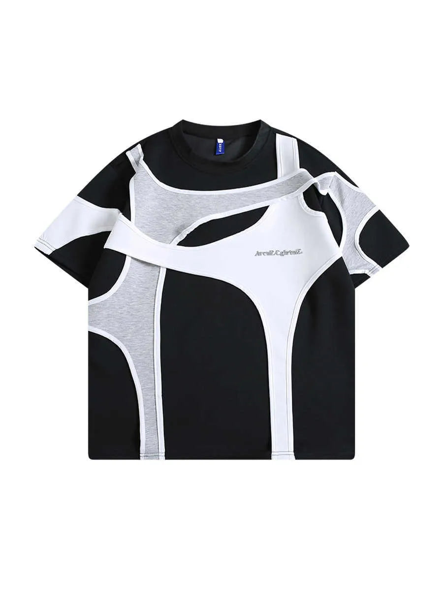 Loose black t-shirt showing double stitching detail forming a padded strap over the shoulder