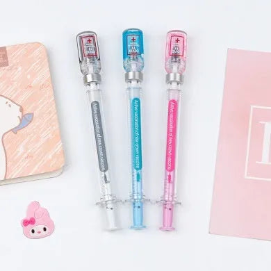 Creative vaccine-style gel pen with black cap, showing 15.7cm length and 0.5mm tip.