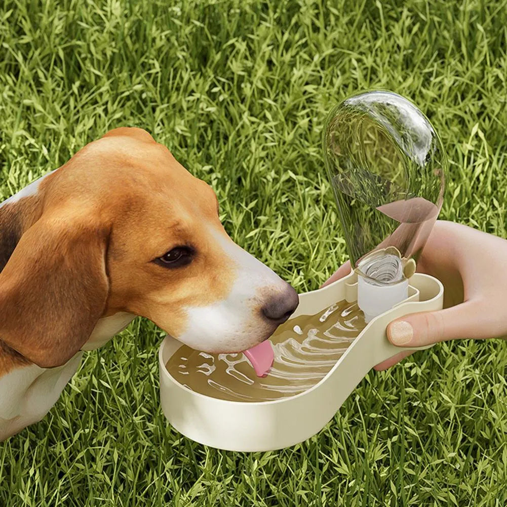 Orange and white portable pet water feeder showing water bottle and food container compartments