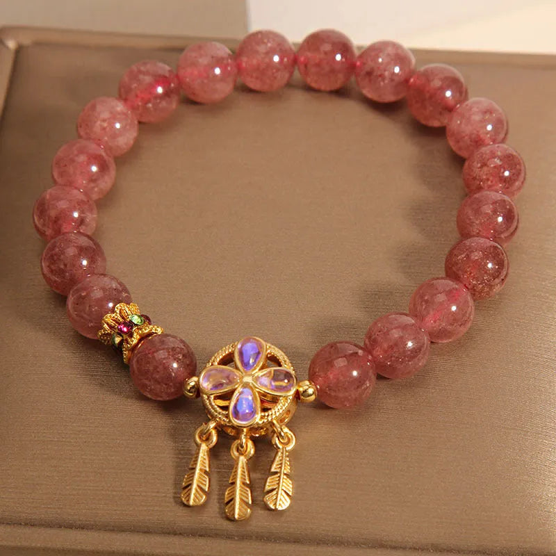 Women's strawberry quartz crystal bracelet with four leaf dream catcher ball pendant