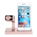 White 2-in-1 charging dock station holding an iPhone and an Apple Watch on a wooden desk.