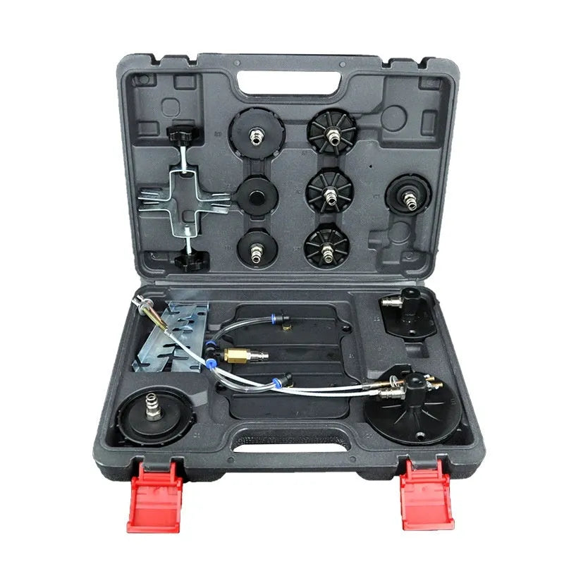 Steel-frame pneumatic brake fluid replacement tool with large tank, pressure gauge, regulator, and clear drain pipe on a workshop bench.
