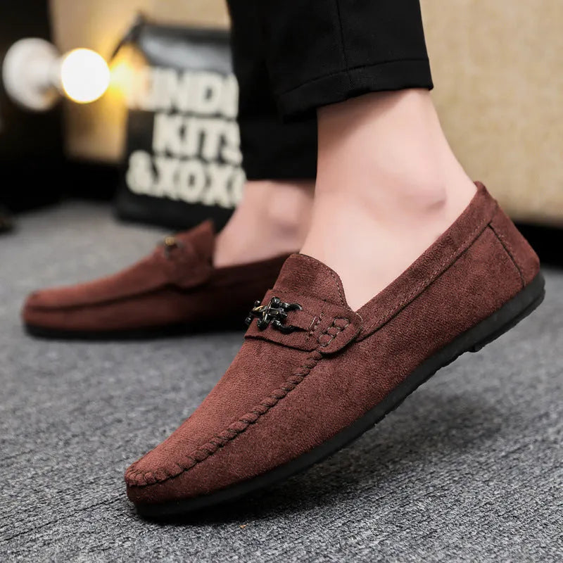 Men's black and brown waterproof slip-on loafers with round toe and rubber sole.