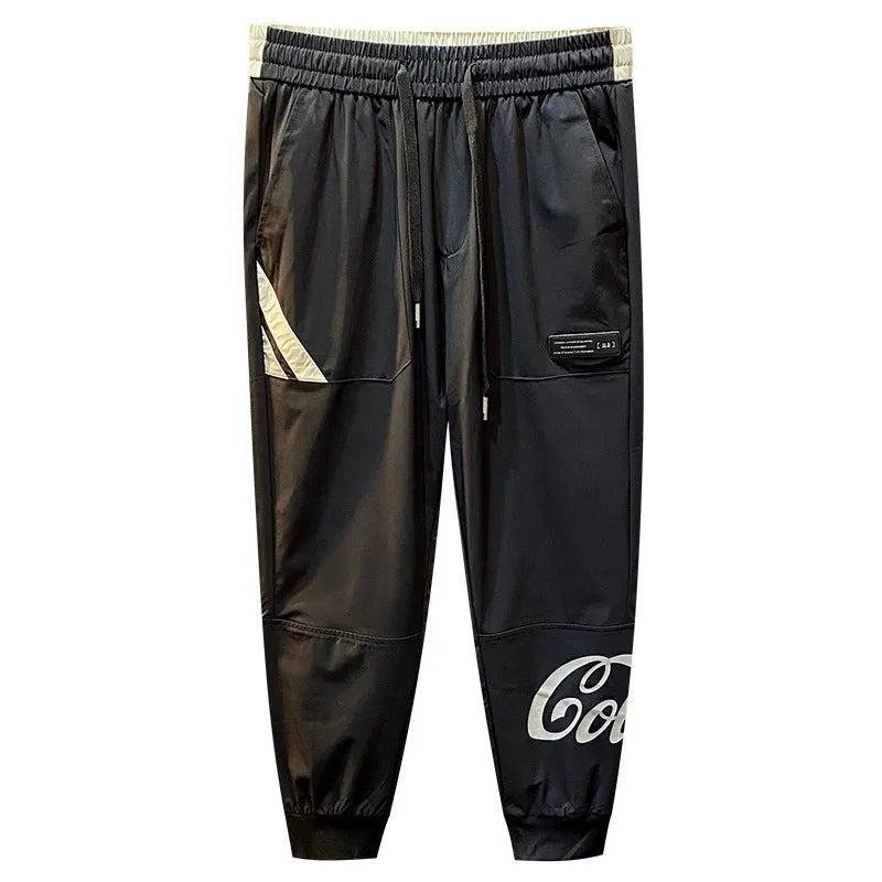Black men's cropped casual trousers with an ankle band, made from thin Ice Silk cotton fabric.