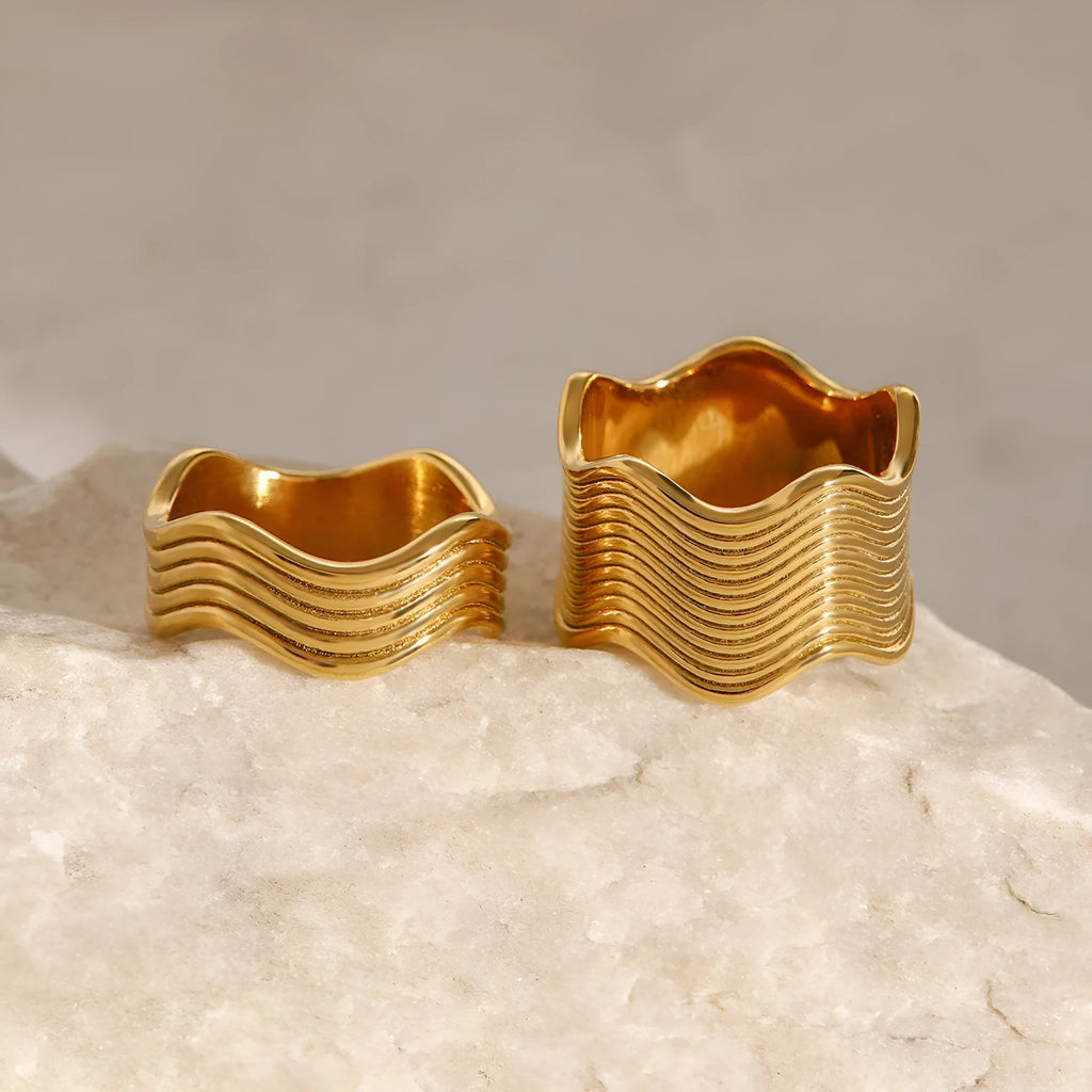 Stainless steel wide band geometric wave ring in Korean style.