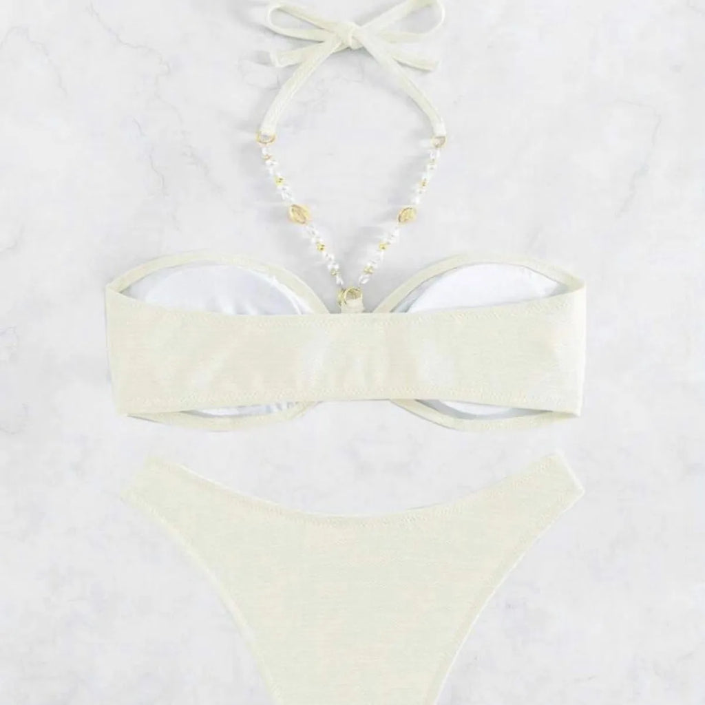Women's halter-style bikini set in solid colour on a white background.