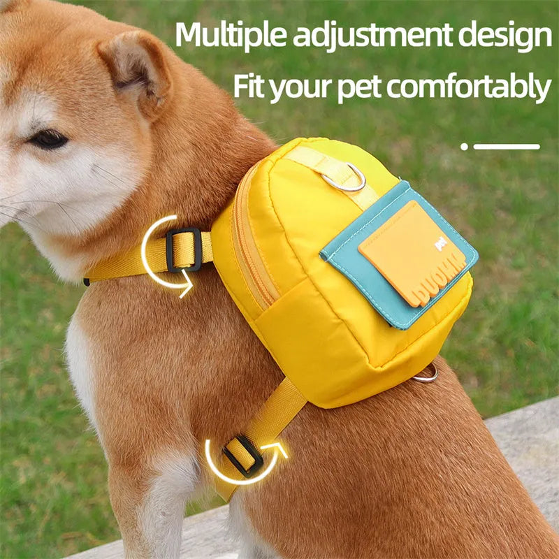 Blue adjustable dog backpack harness with storage compartments and a tow rope attached.