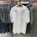Man wearing a beige open collar modal cotton blend casual shirt in a cardigan style