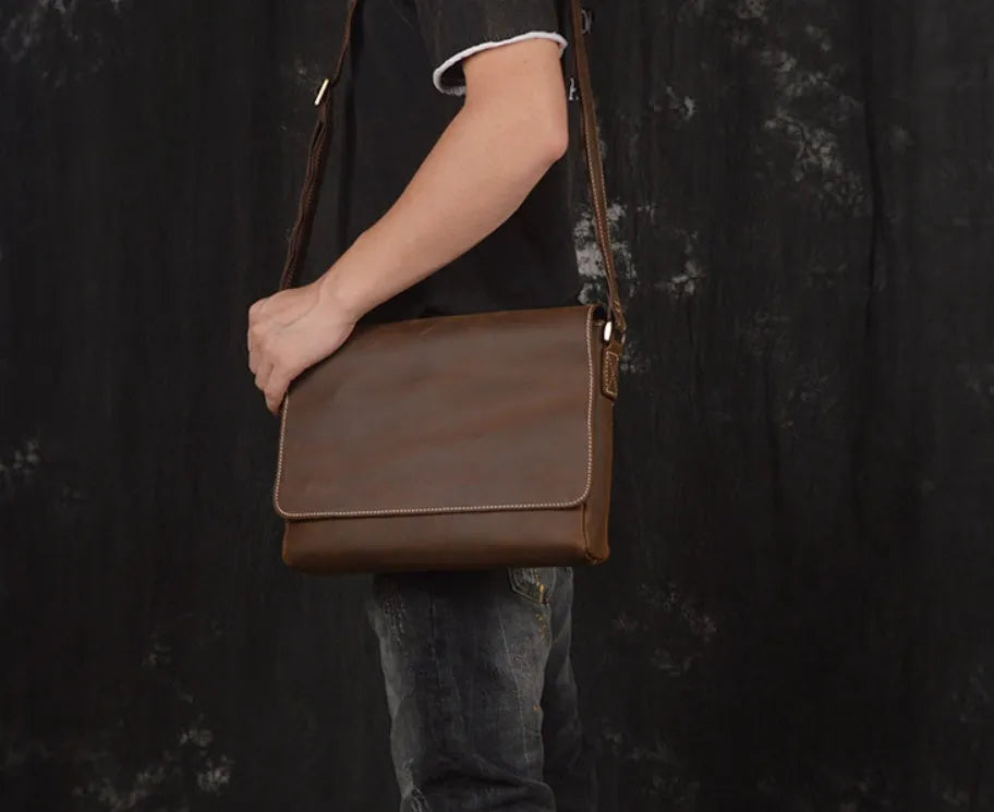 Men's vintage brown leather messenger bag with flap cover and adjustable shoulder strap