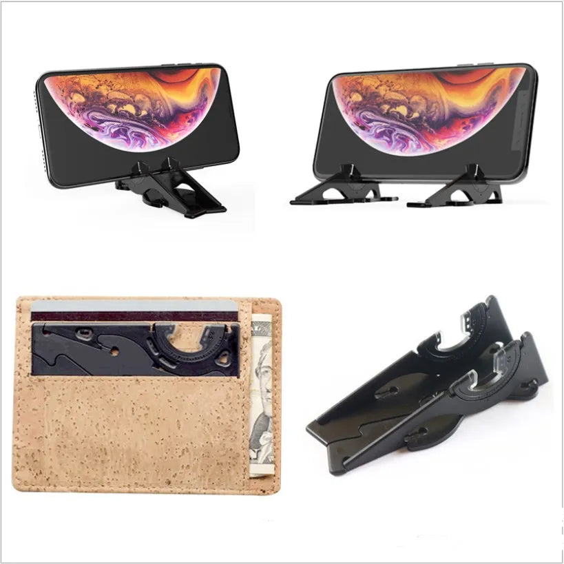 Black plastic card type mobile phone holder with lazy bracket on a desktop.