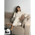 Women's white floral print pyjama suit with bell sleeve top and wide leg trousers