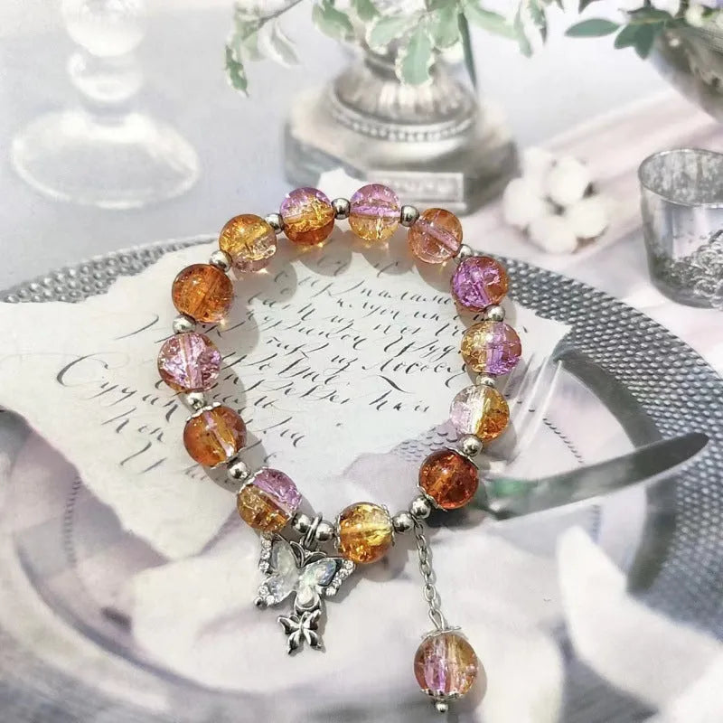 Chinese style handmade glass bead bracelet with bamboo joint elements on a white background.