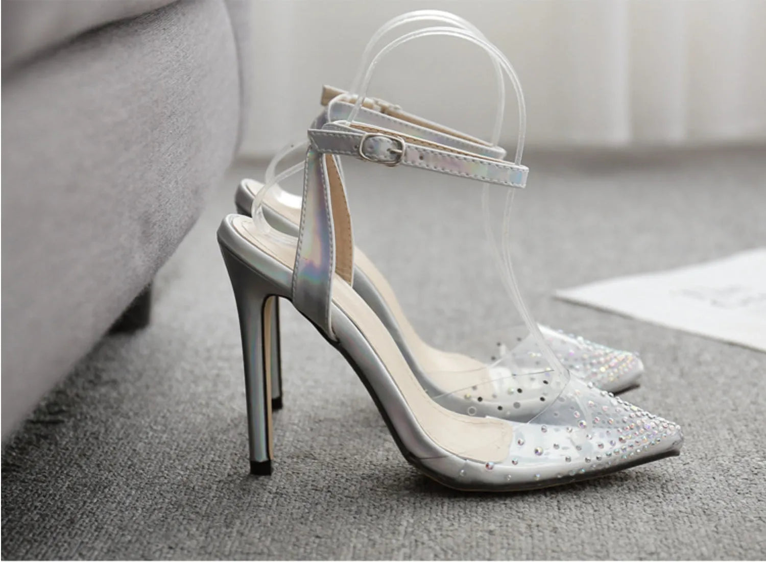 Women's pointed toe diamond sandals with a stiletto heel on a white background.