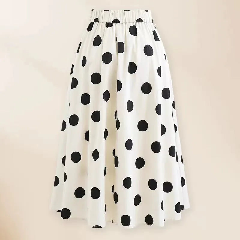 Women's black one-piece swimsuit with a white bow and round skirt, made from polyester.