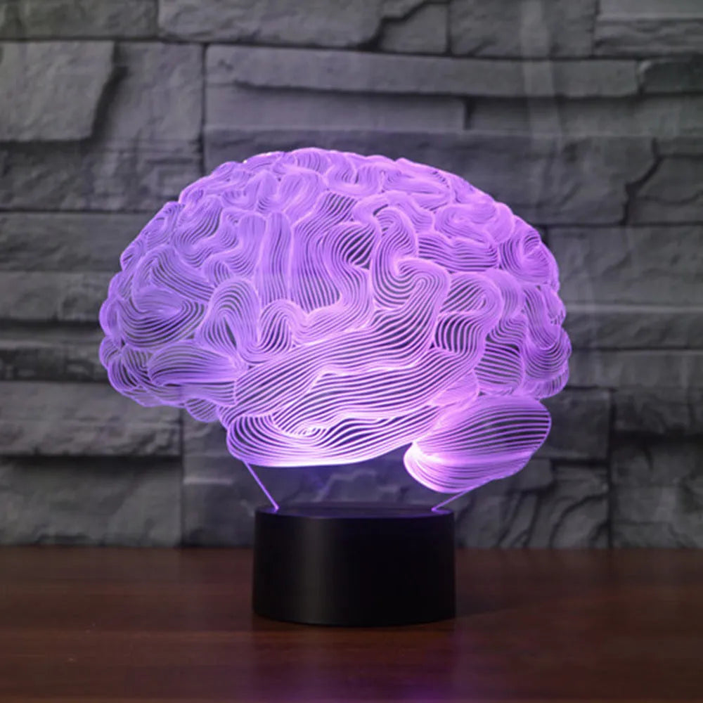 3D brain illusion LED lamp with acrylic plate glowing in multiple colours on a desk