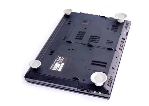 Four grey durable plastic laptop cooling pads in two sizes on a flat surface