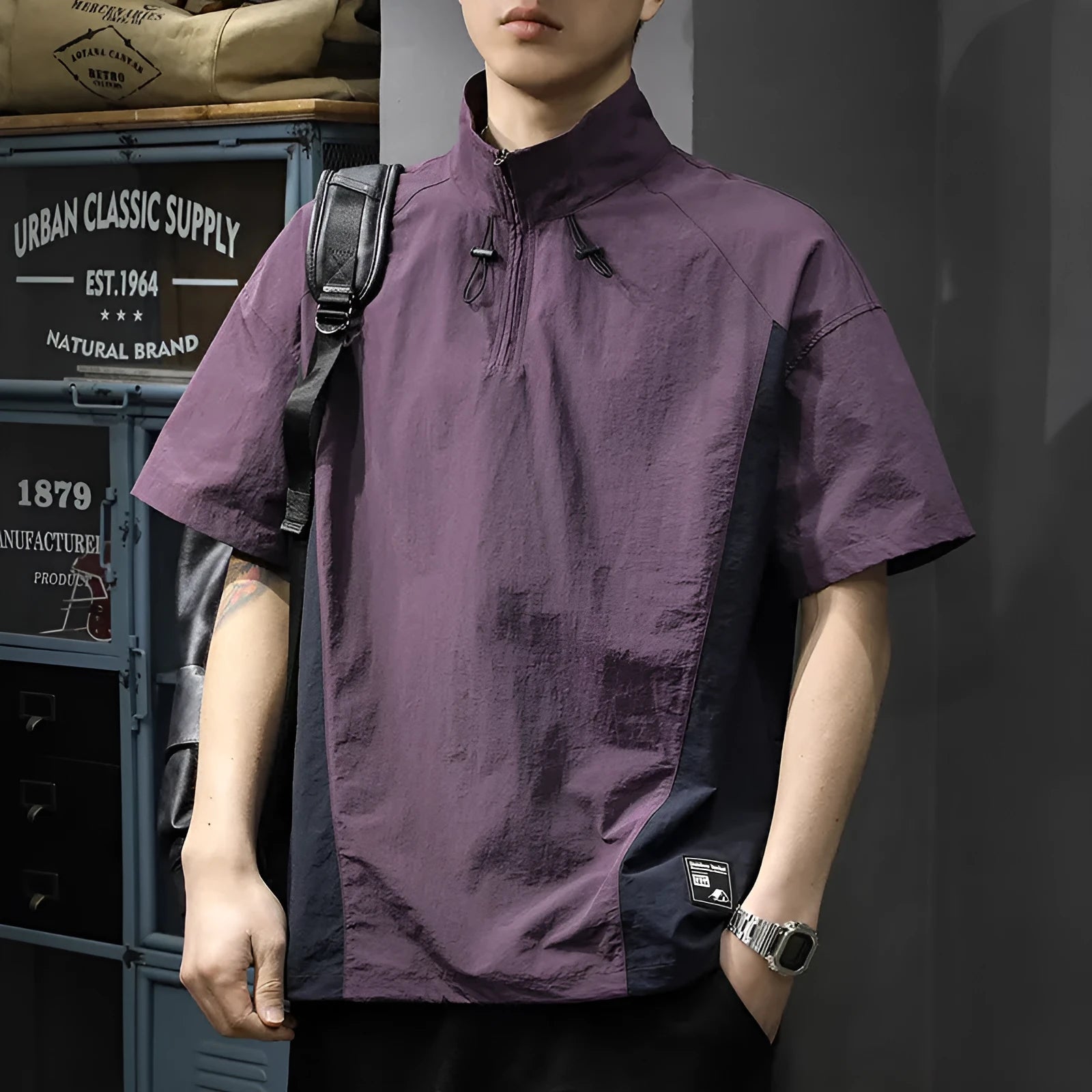 Man wearing a brown half-zip stand collar short sleeve shirt made of Ice Silk fabric.