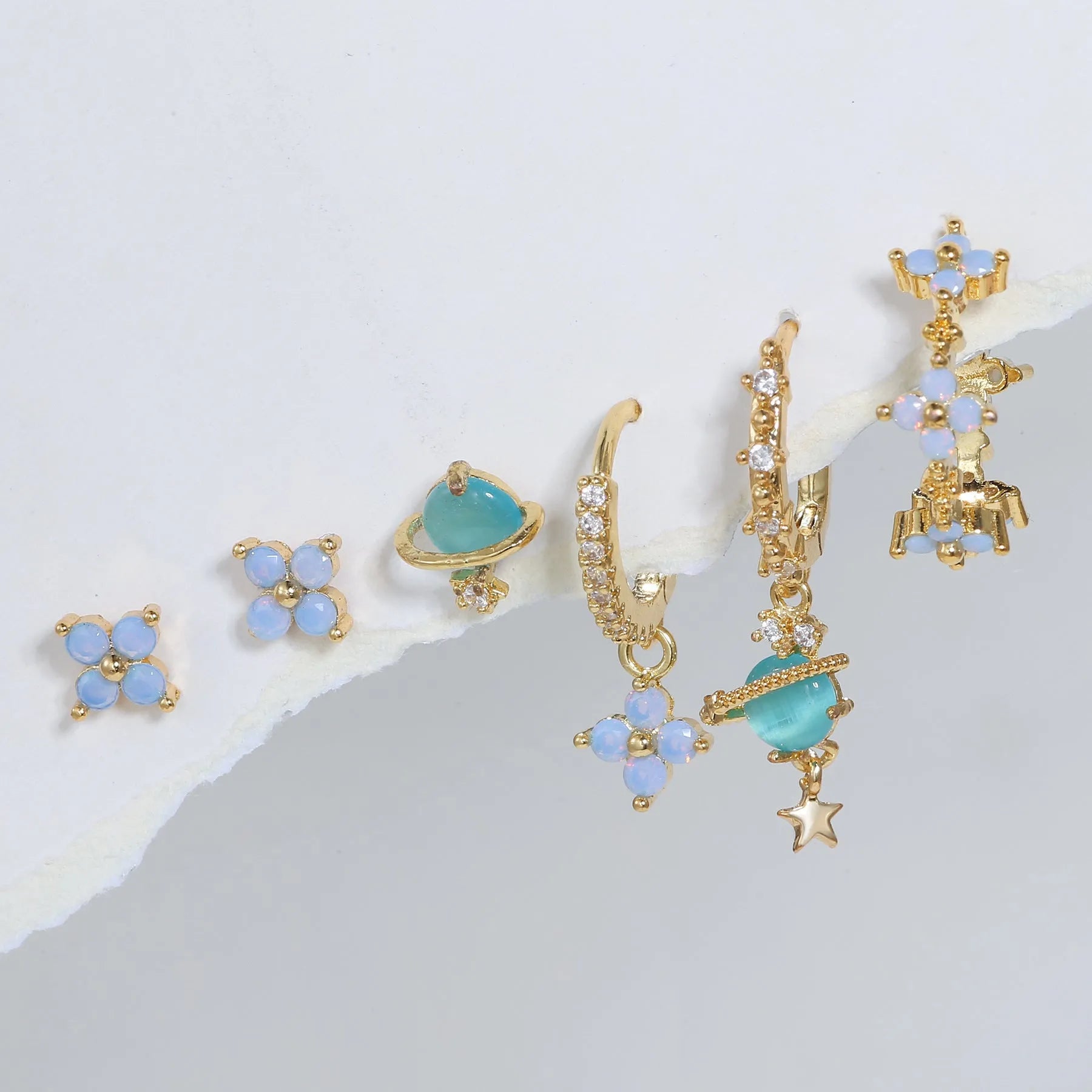 Gold and silver flower stud earrings with zircon stone mosaic centre.