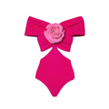 Women's one-piece swimsuit with hollow-out floral pattern and matching skirt on a neutral background