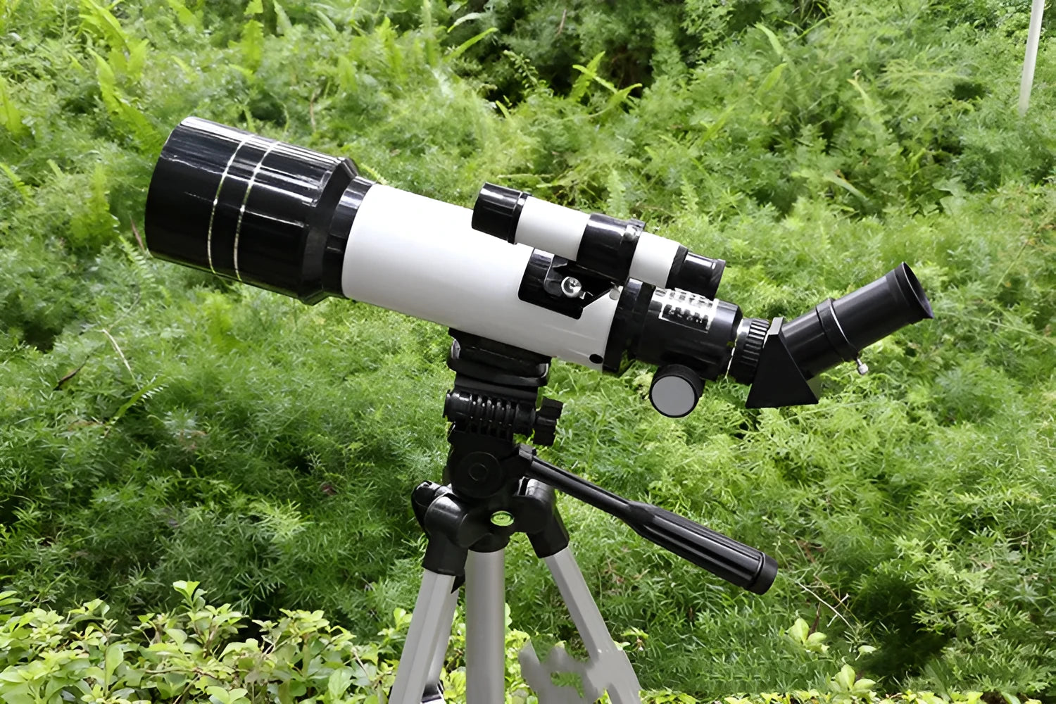 Children's dark blue astronomical telescope with monocular design on tripod, showing eyepiece and adjustment controls