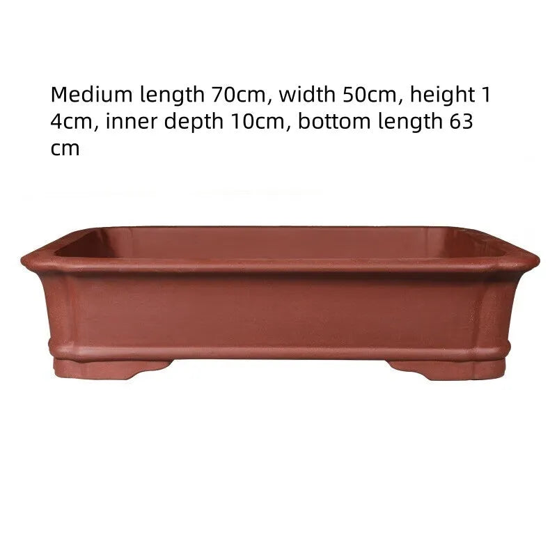 Large rectangular purple clay bonsai flowerpot showing handmade texture and scale.