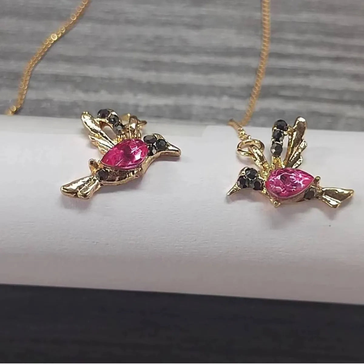 Women's long drop earrings with hanging bird pendants and zirconium crystal accents in blue colour option
