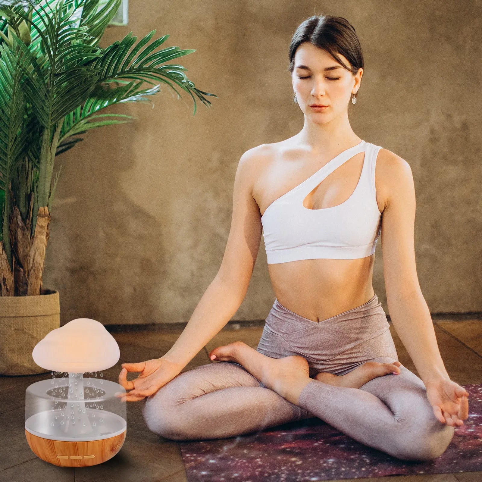 White raining cloud-shaped humidifier with night light and water drop essential oil diffuser.