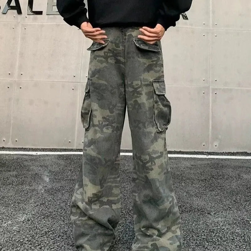 American vintage washed camouflage green cargo trousers with multiple pockets on a neutral background.