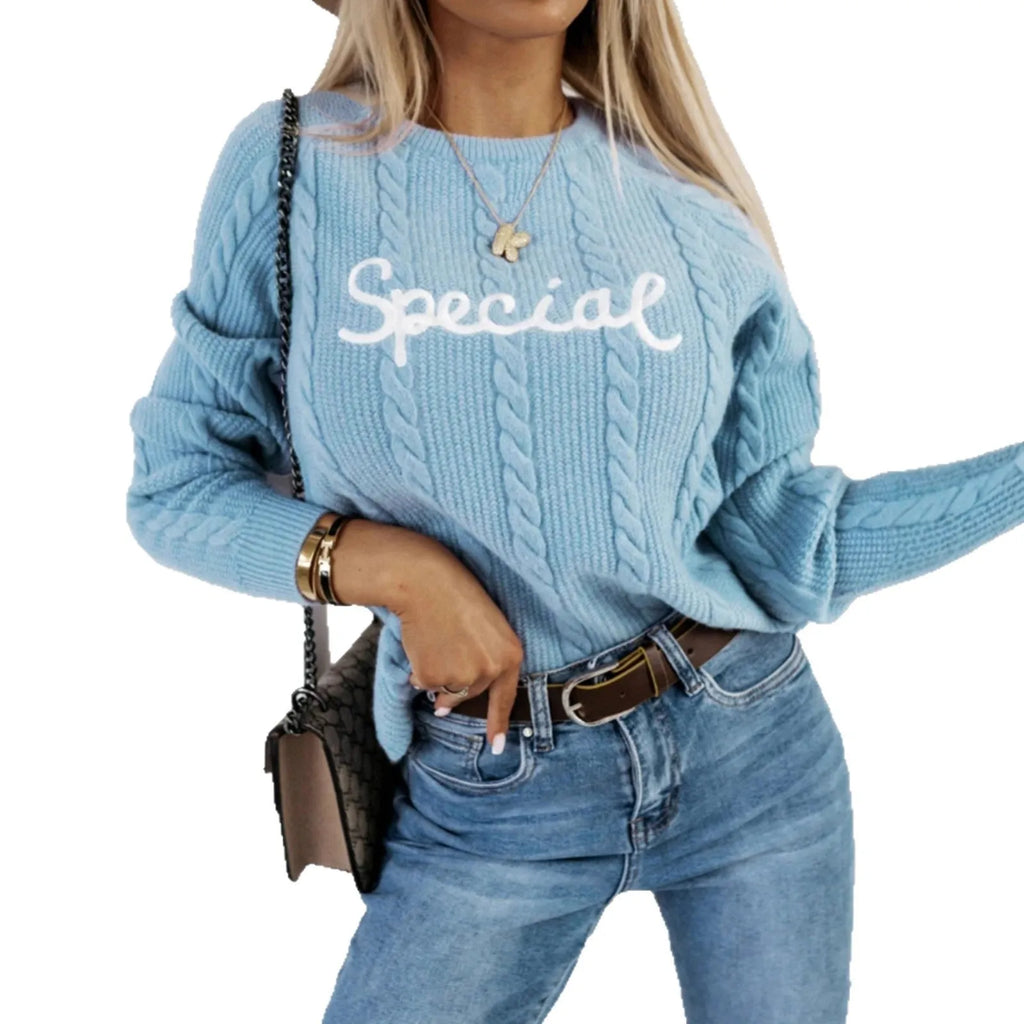 Blue crew neck pullover jumper with embroidered letter and number detailing on the front.