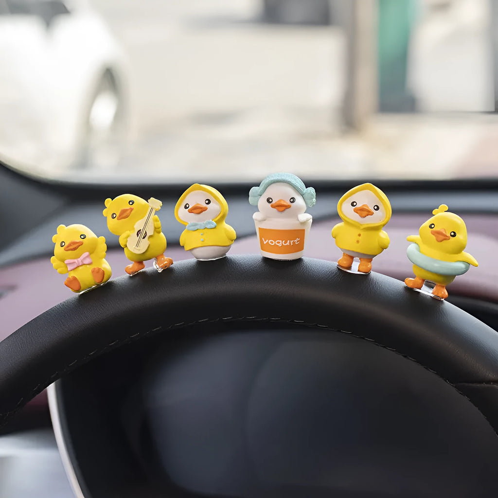 PVC duckling car decoration set with six small duck ornaments and one sign label for dashboard placement