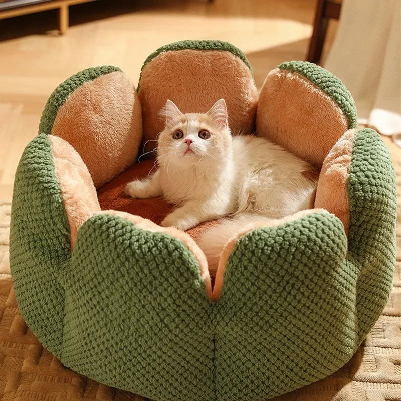 Grey petal-shaped plush kennel bed for cats and dogs on a hardwood floor.