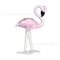 Pink flamingo crystal animal decoration on a tabletop in separate and juxtaposition styles.