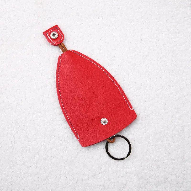 Colourful cartoon pull-out key case made from PU leather, showing the key extended from its protective sleeve.