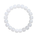 White Hetian jade barrel bead bracelet on a wrist, showing the traditional bead design.
