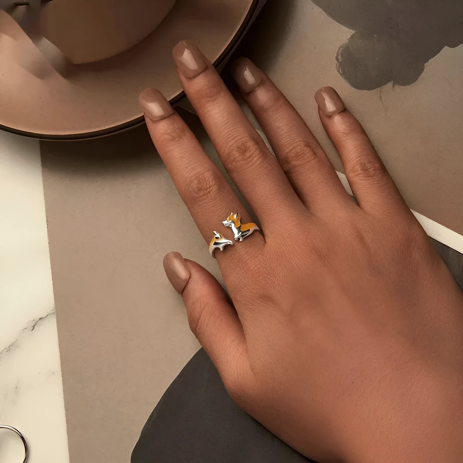 Silver ring with a raised cartoon corgi design in colour SCR1014-E.