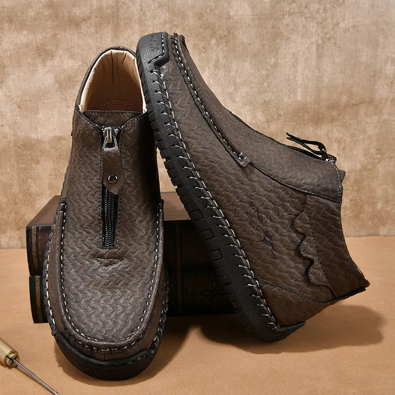 Men's leather slip-on loafers in black brown or grey colours showing round toe and rubber sole design