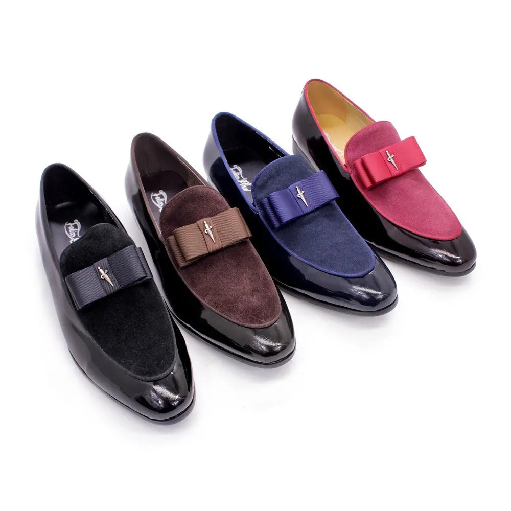 Men's black patent leather dress shoes with a tassel detail and low-top design on a rubber sole.