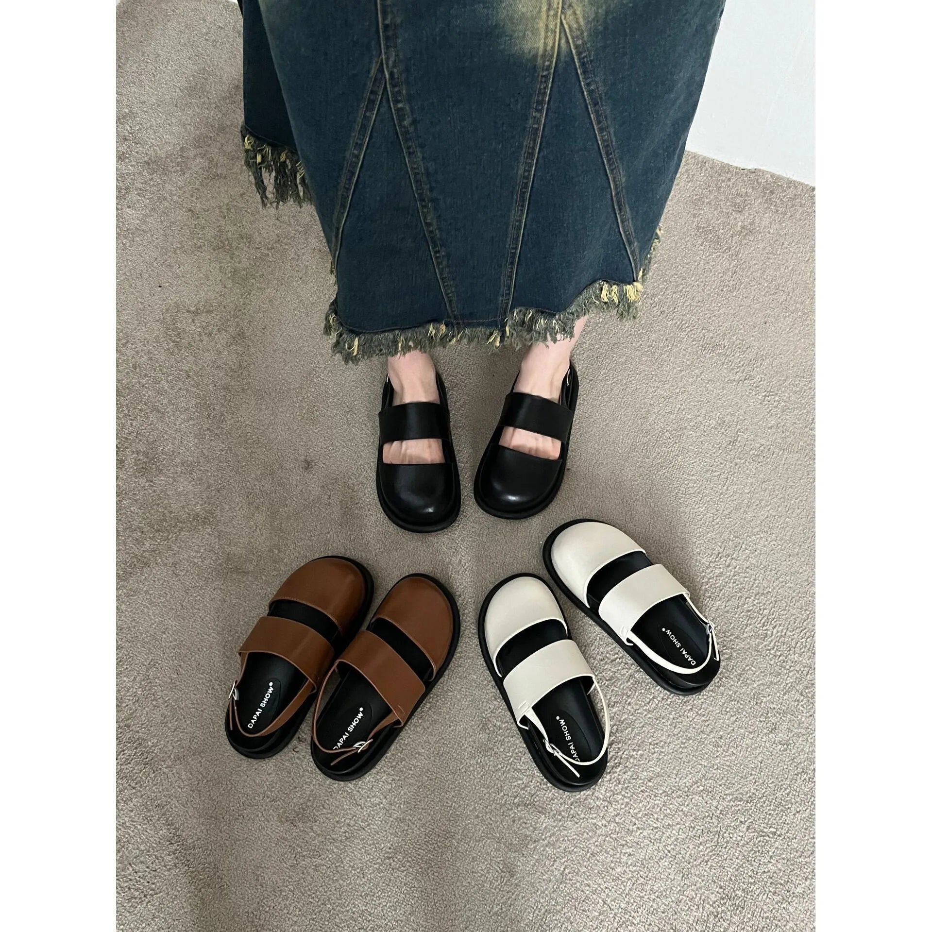 Retro brown platform sandals with a single ankle strap buckle and closed round toe.