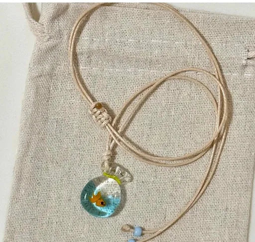 Women's joker charm necklace with coloured glaze pendant on a cotton and linen clavicle chain.