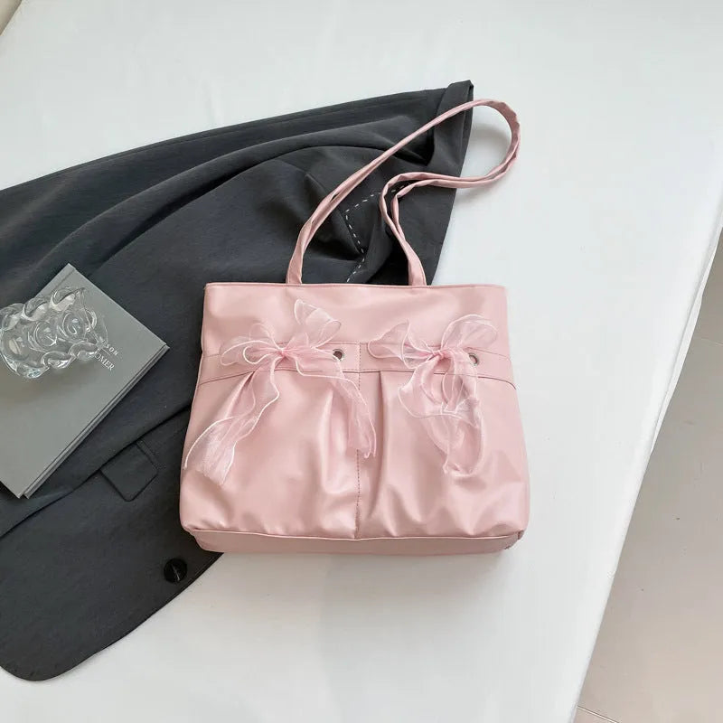 College style bow tote bag in black and pink with large capacity and internal zip compartment